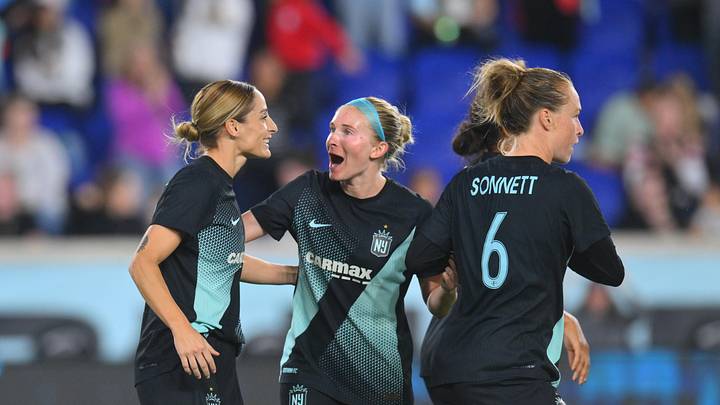 NJ/NY Gotham FC forward Esther Gonzalez (9) celebrates with midfielder Jenna Nighswonger (2) and midfielder Emily Sonnett (6)  