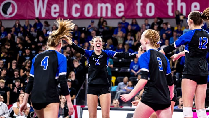 Dike-New Hartford's Maryn Bixby (2) celebrates an ace serve during the Class 2A IGHSAU Iowa Girls High School Athletic Union state volleyball championship match between Dike-New Hartford and Hinton, Thursday, Nov. 2, 2023, at Xtream Arena in Coralville, Iowa.