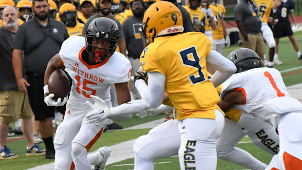 Chris Henry Jr. darts down the sidelines for a Withrow first down at Marx Stadium against Walnut Hills, Aug. 17, 2023.Chris H