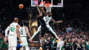 Jaylen Brown blocks Derrick Jones Jr.'s shoat the rim,
