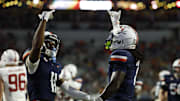 Sep 20, 2025; Charlottesville, Virginia, USA; Virginia Cavaliers wide receiver Trell Harris (11) celebrates with Cavaliers wide receiver Jahmal Edrine (7) after catching a touchdown pass against the Stanford Cardinal during the first quarter at Scott Stadium. Mandatory Credit: Geoff Burke-Imagn Images