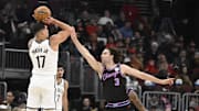 Dec 3, 2025; Chicago, Illinois, USA;  Brooklyn Nets forward Michael Porter Jr. (17) shoots against Chicago Bulls guard Josh Giddey (3) during the first half at the United Center. Mandatory Credit: Matt Marton-Imagn Images