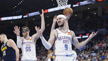 Mar 10, 2025; Oklahoma City, Oklahoma, USA; Oklahoma City Thunder guard Alex Caruso (9) and center Isaiah Hartenstein (55) react after a call on a play against the Denver Nuggets during the second quarter at Paycom Center. Mandatory Credit: Alonzo Adams-Imagn Images