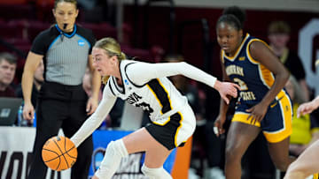 Iowa's Lucy Olsen (33) gets a loose ball during first half of the first round of the NCAA Women's college basketball game between Iowa and Murray State at the Llyod Noble Center in Norman, Okla., Saturday, March, 22, 2025.