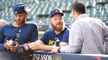 Oct 3, 2023; Milwaukee, Wisconsin, USA; Milwaukee Brewers starting pitcher Brandon Woodruff (53), who recently was ruled out for the Wildcard series is seen out front of the dug out before their game against the Arizona Diamondbacks during game one of the Wildcard series for the 2023 MLB playoffs at American Family Field. Mandatory Credit: Michael McLoone-Imagn Images