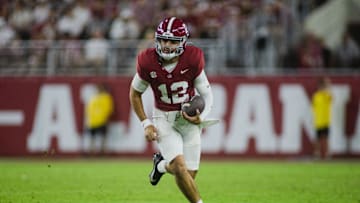 Aug 31, 2024; Tuscaloosa, Alabama, USA; Alabama Crimson Tide quarterback Dylan Lonergan (12) runs the ball against the Western Kentucky Hilltoppers during the fourth quarter at Bryant-Denny Stadium. Mandatory Credit: Will McLelland-Imagn Images