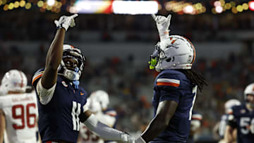 Sep 20, 2025; Charlottesville, Virginia, USA; Virginia Cavaliers wide receiver Trell Harris (11) celebrates with Cavaliers wide receiver Jahmal Edrine (7) after catching a touchdown pass against the Stanford Cardinal during the first quarter at Scott Stadium. Mandatory Credit: Geoff Burke-Imagn Images