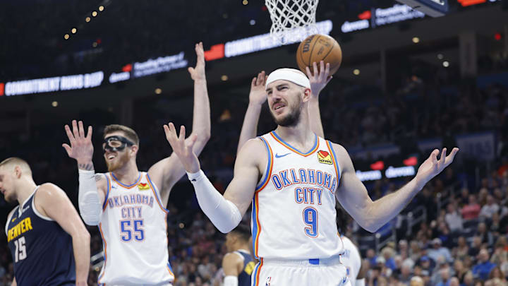 Mar 10, 2025; Oklahoma City, Oklahoma, USA; Oklahoma City Thunder guard Alex Caruso (9) and center Isaiah Hartenstein (55) react after a call on a play against the Denver Nuggets during the second quarter at Paycom Center. Mandatory Credit: Alonzo Adams-Imagn Images