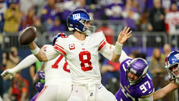 Jan 15, 2023; Minneapolis, Minnesota, USA; New York Giants quarterback Daniel Jones (8) passes the ball against the Minnesota Vikings during the first quarter of a wild card game at U.S. Bank Stadium. Mandatory Credit: Matt Krohn-Imagn Images