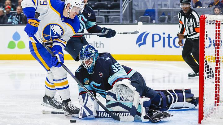 Jan 20, 2025; Seattle, Washington, USA; Seattle Kraken goaltender Joey Daccord (35) makes a save on a shot attempt by Buffalo Sabres left wing Beck Malenstyn (29) during the second period at Climate Pledge Arena. Mandatory Credit: Joe Nicholson-Imagn Images