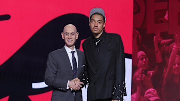 Jun 25, 2025; Brooklyn, NY, USA;  Noa Essengue stands with NBA commissioner Adam Silver after being selected as the 12th pick by the Chicago Bulls in the first round of the 2025 NBA Draft at Barclays Center. Mandatory Credit: Brad Penner-Imagn Images