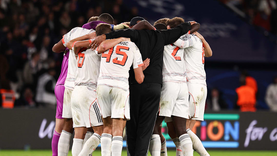 Bayern Munich players and Vincent Kompany in huddle after 2-1 win against Paris Saint-Germain.