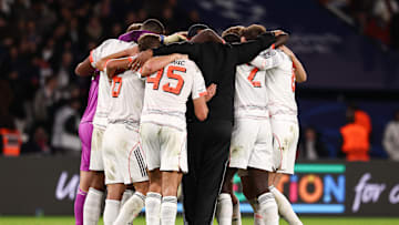 Bayern Munich players and Vincent Kompany in huddle after 2-1 win against Paris Saint-Germain.