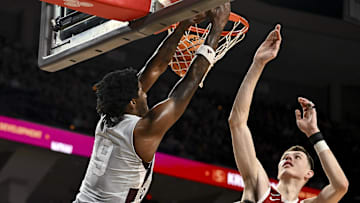 Feb 15, 2025; College Station, Texas, USA; Texas A&M Aggies forward Solomon Washington (9) dunks the ball  against the Arkansas Razorbacks during the first half at Reed Arena. Mandatory Credit: Maria Lysaker-Imagn Images 