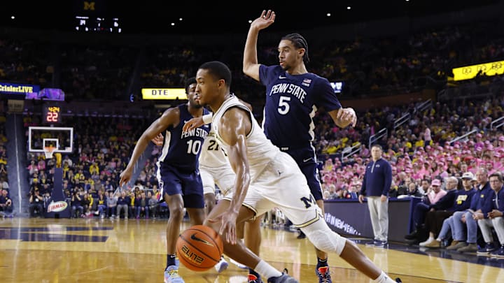 Feb 5, 2026; Ann Arbor, Michigan, USA;  Michigan Wolverines guard Nimari Burnett (4) dribbles against Penn State Nittany Lions guard Freddie Dilione V (5) in the first half t Crisler Center. Mandatory Credit: Rick Osentoski-Imagn Images