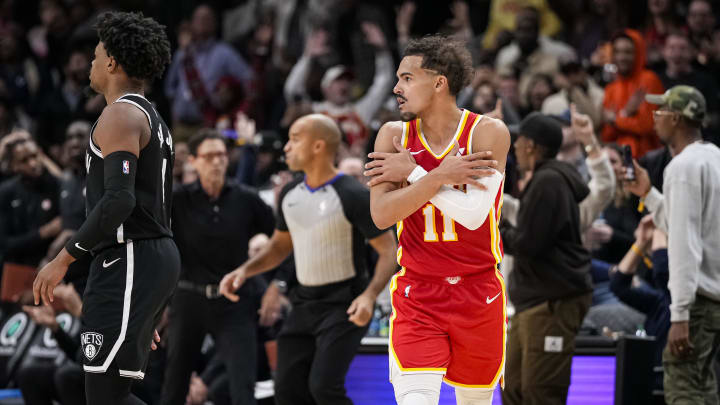 Dec 6, 2023; Atlanta, Georgia, USA; Atlanta Hawks guard Trae Young (11) reacts after giving the Hawks the lead in the final minute  against the Brooklyn Nets during the second half at State Farm Arena. Mandatory Credit: Dale Zanine-USA TODAY Sports