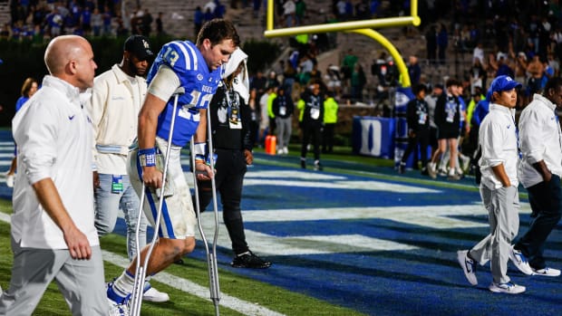 Riley Leonard leaves the field on crutches after Notre Dame beat Duke in the final seconds in 2023.