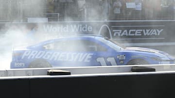 Sep 7, 2025; Madison, Illinois, USA; NASCAR Cup Series driver Denny Hamlin (11) celebrates after winning the Enjoy Illinois 300 at World Wide Technology Raceway.