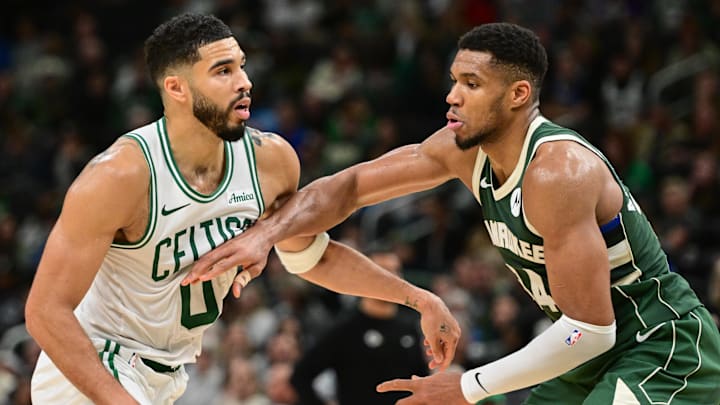 Nov 10, 2024; Milwaukee, Wisconsin, USA; Boston Celtics forward Jayson Tatum (0) and Milwaukee Bucks forward Giannis Antetokounmpo (34) jostle for position in the fourth quarter at Fiserv Forum. Mandatory Credit: Benny Sieu-Imagn Images