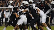 Oct 4, 2025; Fort Worth, Texas, USA; Colorado Buffaloes running back Micah Welch (29) is tackled by a host of TCU Horned Frogs defenders during the second half at Amon G. Carter Stadium. Mandatory Credit: Raymond Carlin III-Imagn Images