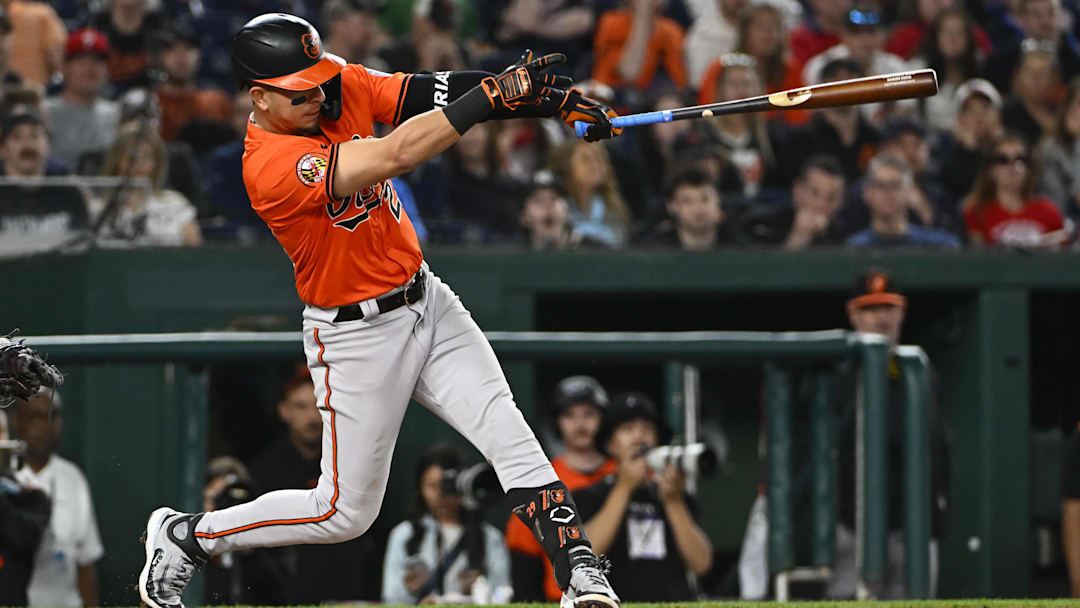 Apr 23, 2025; Washington, District of Columbia, USA; Baltimore Orioles third base Ramón Urías (29) hits a RBI sacrifice fly against the Washington Nationals during the eighth inning at Nationals Park. Brad Mills-Imagn Images