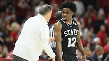 Mar 8, 2025; Fayetteville, Arkansas, USA; Mississippi State Bulldogs head coach Chris Jans talks to guard Josh Hubbard (12) during the first half against the Arkansas Razorbacks at Bud Walton Arena. 