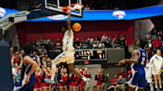 Southern Indiana's Stephen Olowoniyi (12) dunks as the University of Southern Indiana Screaming Eagles play the Indiana State Sycamores at Liberty Arena in Evansville, Ind., Monday, Nov. 25, 2024.