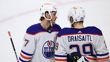 Edmonton Oilers center Connor McDavid talks with Leon Draisaitl