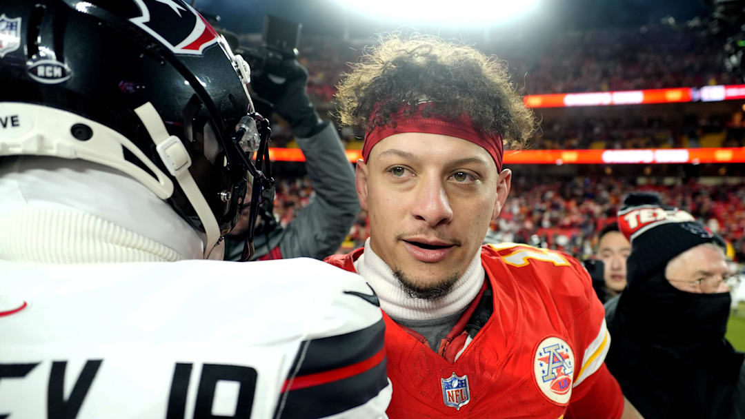 Jan 18, 2025; Kansas City, Missouri, USA; Kansas City Chiefs quarterback Patrick Mahomes (15) meets with Houston Texans cornerback Derek Stingley Jr. (24) after a 2025 AFC divisional round game at GEHA Field at Arrowhead Stadium. Mandatory Credit: Jay Biggerstaff-Imagn Images
