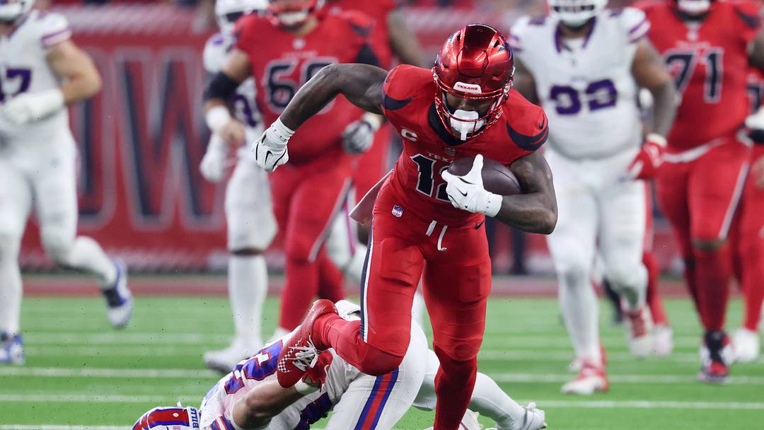 Nov 20, 2025; Houston, Texas, USA; Houston Texans wide receiver Nico Collins (12) runs against Buffalo Bills safety Cole Bishop (24) in the second quarter at NRG Stadium. Mandatory Credit: Troy Taormina-Imagn Images