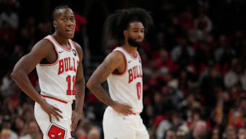 Ayo Dosunmu and Coby White of the Chicago Bulls react during an NBA game against the Oklahoma City Thunder.