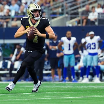 Sep 15, 2024; Arlington, Texas, USA;  New Orleans Saints quarterback Derek Carr (4) throws during the second half against the Dallas Cowboys at AT&T Stadium.  