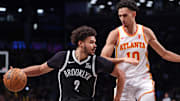 Mar 16, 2025; Brooklyn, New York, USA; Brooklyn Nets forward Cameron Johnson (2) is defended by Atlanta Hawks forward Zaccharie Risacher (10) during the second half at Barclays Center. Mandatory Credit: Vincent Carchietta-Imagn Images