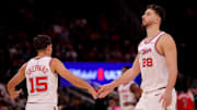 Nov 12, 2025; Houston, Texas, USA; Houston Rockets guard Reed Sheppard (15) congratulates Houston Rockets center Alperen Sengun (28) during a timeout against the Washington Wizards during the fourth quarter at Toyota Center. Mandatory Credit: Erik Williams-Imagn Images