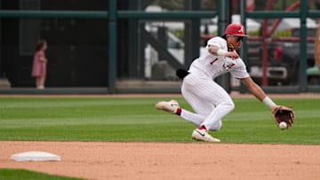 Mar 29, 2025; Tuscaloosa, AL, USA; Alabama shortstop Justin Lebron (1) goes deep in the hole behind second to field a ball hit up the middle but was unable to throw to first in time for an out during the game with Oklahoma at Sewell-Thomas Stadium. Oklahoma evened the series with a 6-5 win.