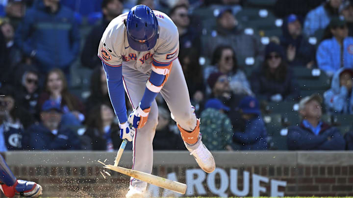 Apr 19, 2026; Chicago, Illinois, USA;  New York Mets third baseman Mark Vientos (27) breaks his bat after popping up against the Chicago Cubs at Wrigley Field. Mandatory Credit: Matt Marton-Imagn Images
