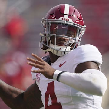 Sep 14, 2024; Madison, Wisconsin, USA;  Alabama Crimson Tide quarterback Jalen Milroe (4) throws a pass during warmups prior to the game against the Wisconsin Badgers at Camp Randall Stadium. Mandatory Credit: Jeff Hanisch-Imagn Images