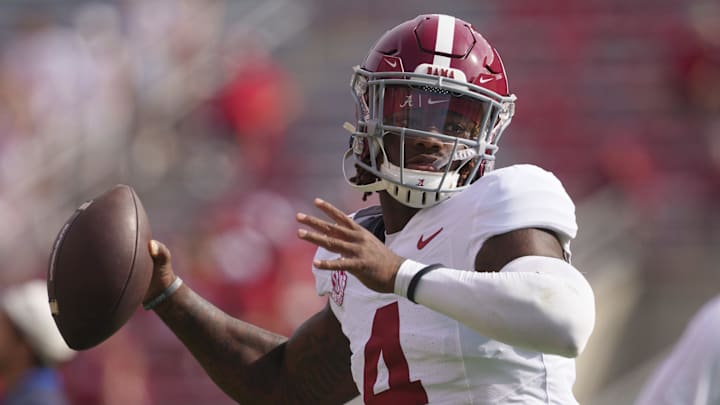 Sep 14, 2024; Madison, Wisconsin, USA;  Alabama Crimson Tide quarterback Jalen Milroe (4) throws a pass during warmups prior to the game against the Wisconsin Badgers at Camp Randall Stadium. Mandatory Credit: Jeff Hanisch-Imagn Images