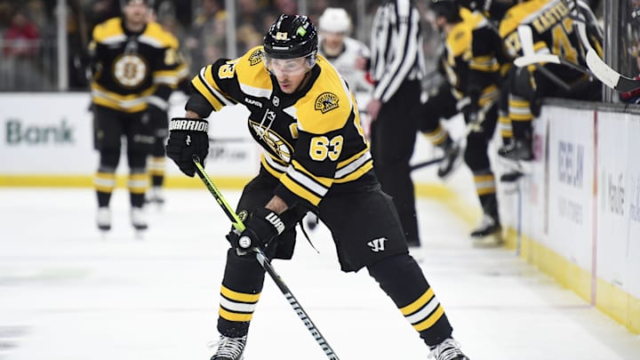Dec 23, 2024; Boston, Massachusetts, USA;  Boston Bruins left wing Brad Marchand (63) controls the puck during the first period against the Washington Capitals at TD Garden. Mandatory Credit: Bob DeChiara-Imagn Images