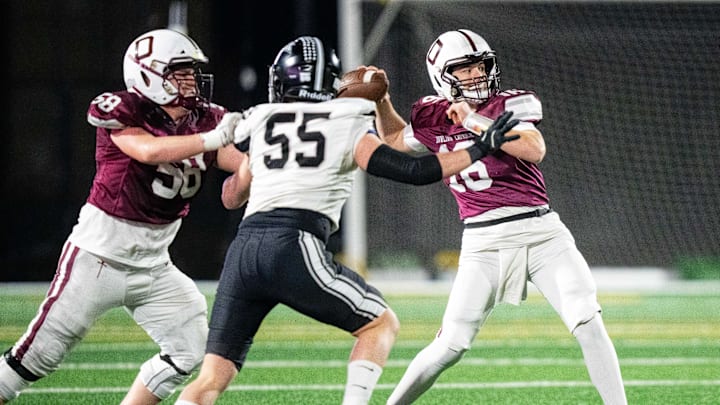Dowling's Joey Nahas (16) looks to throw deep to a receiver downfield on Friday, Nov. 8, 2024, at Mediacom Stadium.