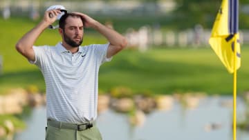 May 16, 2024; Louisville, Kentucky, USA; Scottie Scheffler takes off his hat while lining up a shot