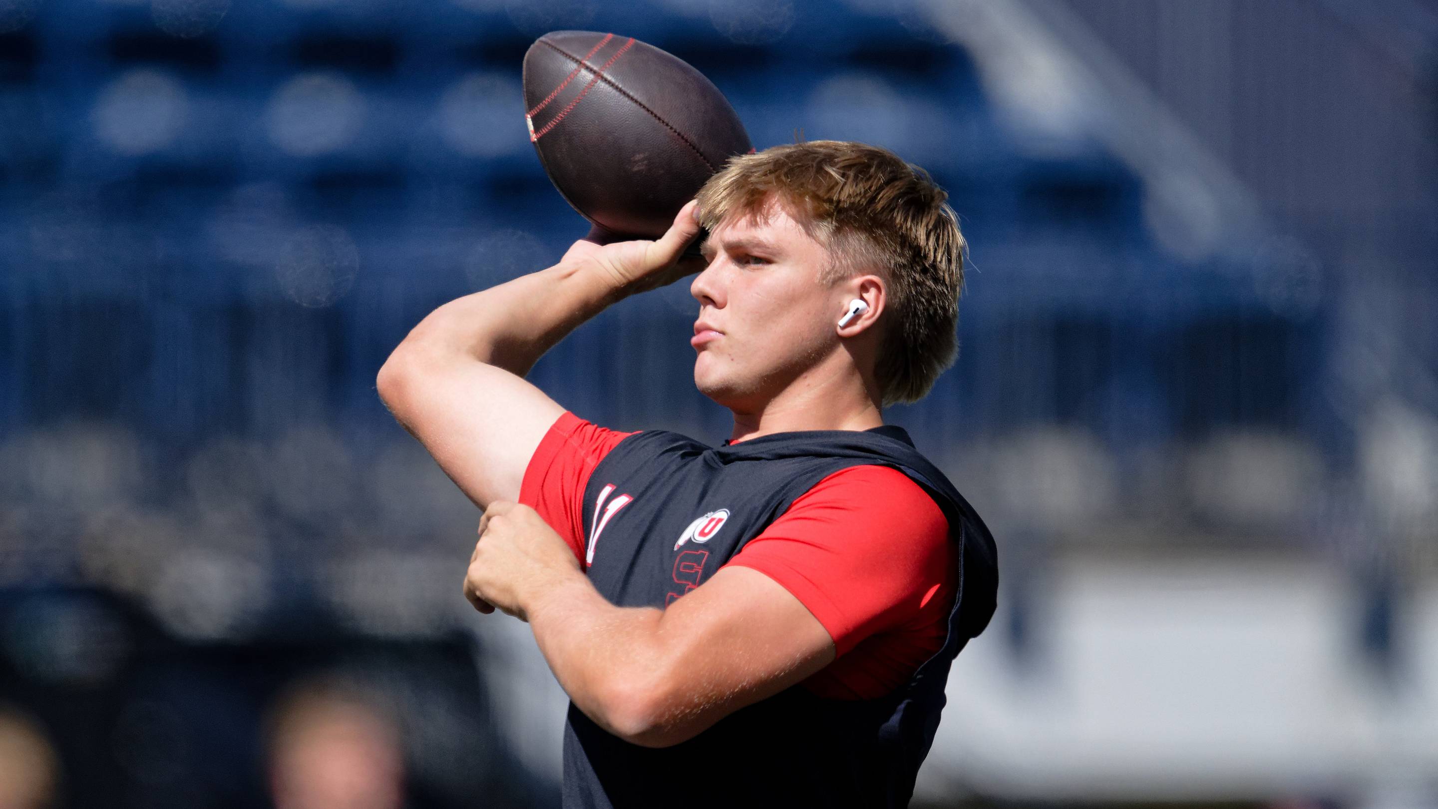 Sep 14, 2024; Logan, Utah, USA; Utah Utes quarterback Isaac Wilson (11) warms up before a game against the Utah State Aggies at Merlin Olsen Field at Maverik Stadium. Mandatory Credit: Jamie Sabau-Imagn Images
