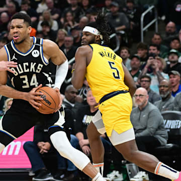 Apr 27, 2025; Milwaukee, Wisconsin, USA; Milwaukee Bucks forward Giannis Antetokounmpo (34) looks for a shot against Indiana Pacers guard Ben Sheppard (26) and  forward Jarace Walker (5) in the third quarter during game four of first round for the 2024 NBA Playoffs at Fiserv Forum. Mandatory Credit: Benny Sieu-Imagn Images