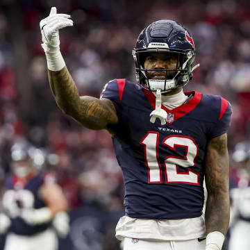 Jan 13, 2024; Houston, Texas, USA; Houston Texans wide receiver Nico Collins (12) celebrates catching the ball during the first quarter in a 2024 AFC wild card game at NRG Stadium. Mandatory Credit: Thomas Shea-USA TODAY Sports
