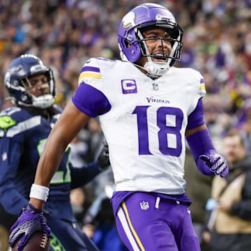 Dec 22, 2024; Seattle, Washington, USA; Minnesota Vikings wide receiver Justin Jefferson (18) celebrates after catching a touchdown pass against the Seattle Seahawks during the fourth quarter at Lumen Field.