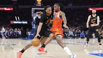 Jan 16, 2025; Oklahoma City, Oklahoma, USA; Cleveland Cavaliers guard Darius Garland (10) drives to the basket as Oklahoma City Thunder guard Cason Wallace (22) defends during the second quarter at Paycom Center. Mandatory Credit: Alonzo Adams-Imagn Images