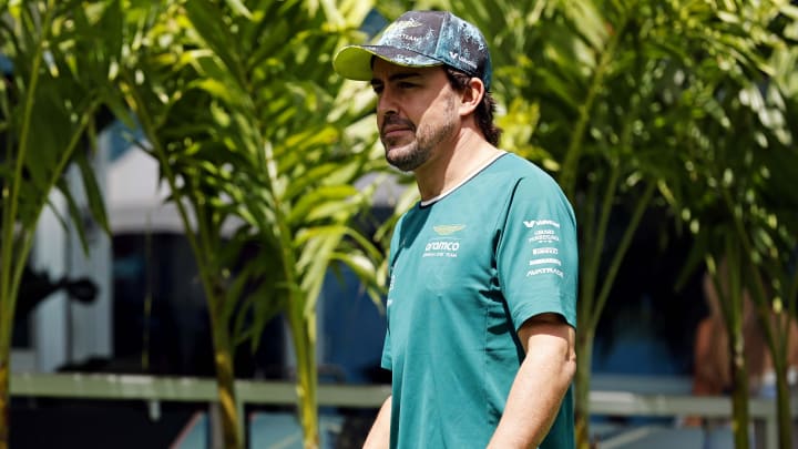 May 5, 2024; Miami Gardens, Florida, USA; Aston Matrin driver Fernando Alonso (14) walks into the F1 Village before the F1 Miami Grand Prix at Miami International Autodrome. Mandatory Credit: Peter Casey-USA TODAY Sports