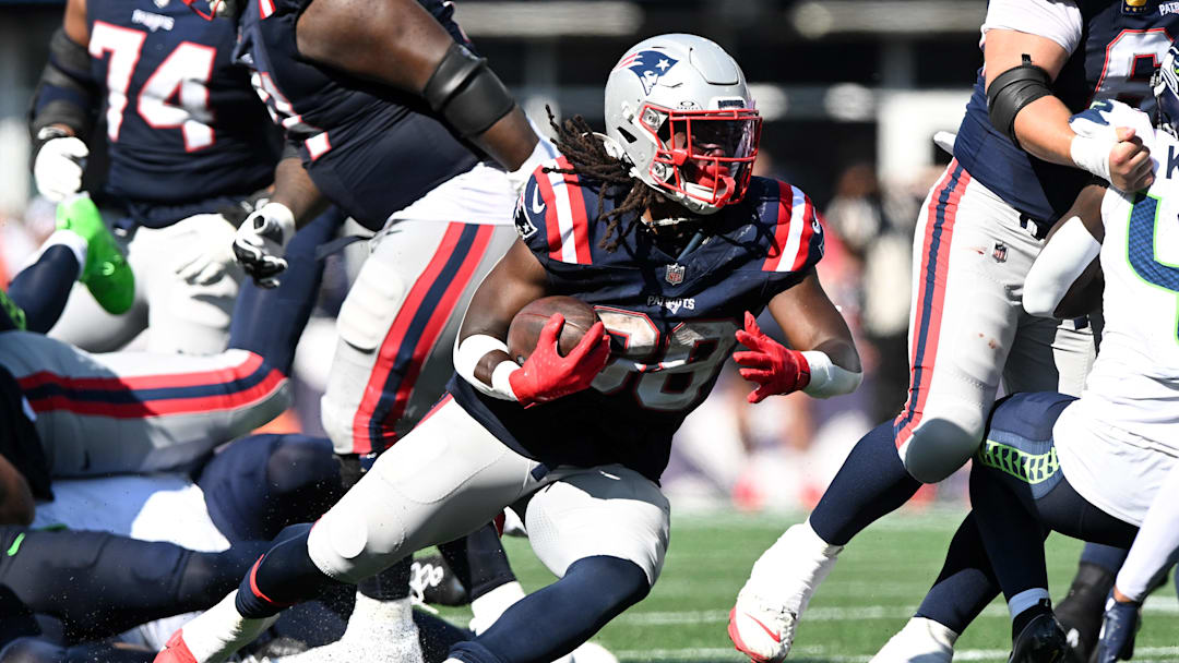 Sep 15, 2024; Foxborough, Massachusetts, USA;  New England Patriots running back Rhamondre Stevenson (38) runs with the ball against the Seattle Seahawks during the second half at Gillette Stadium. Mandatory Credit: Brian Fluharty-Imagn Images