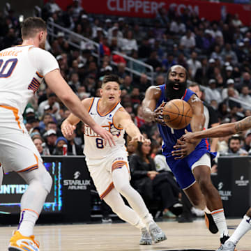Jan 8, 2024; Los Angeles, California, USA;  Los Angeles Clippers guard James Harden (1) is fouled by Phoenix Suns guard Bradley Beal (3) during the second quarter at Crypto.com Arena. Mandatory Credit: Kiyoshi Mio-Imagn Images