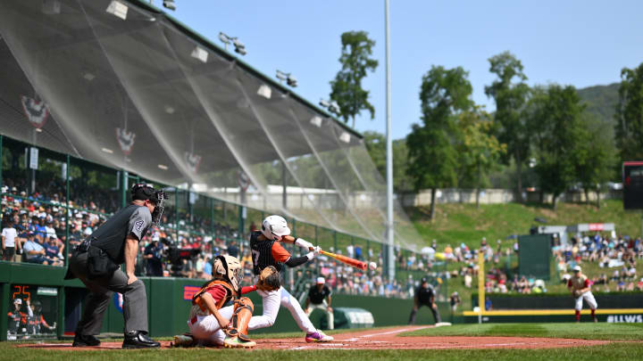 Metro Region infielder Dean Scarangello (7) bats against Mountain Region in the second inning at Lamade Stadium in 2024.